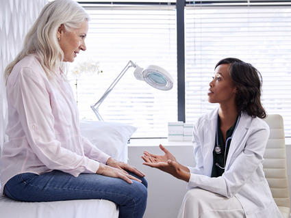 Mature Woman In Consultation With Female Doctor