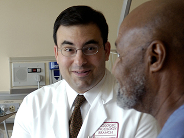 A Male Doctor Talking with a Male Patient