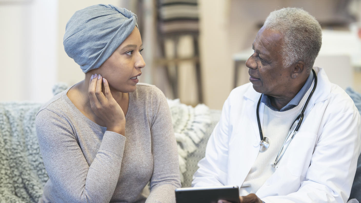 Cancer patient talking with her doctor